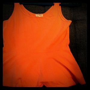 A salmon colored cropped top